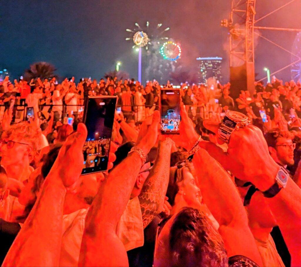 Crowded nightclub and concert atmosphere with people socialising and meeting new friends during a night out