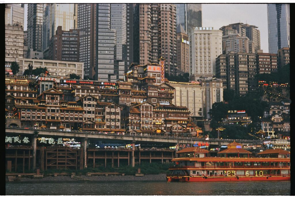 Modern city skyline in China with traditional architecture and riverfront