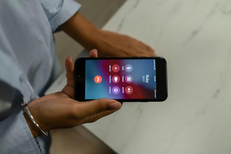 Person holding a smartphone during an incoming phone call, representing phone anxiety, modern communication, and generation Z phone behavior