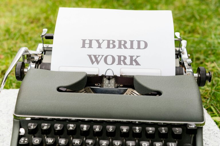 Hybrid work concept on vintage typewriter representing flexible work schedule and remote office culture
