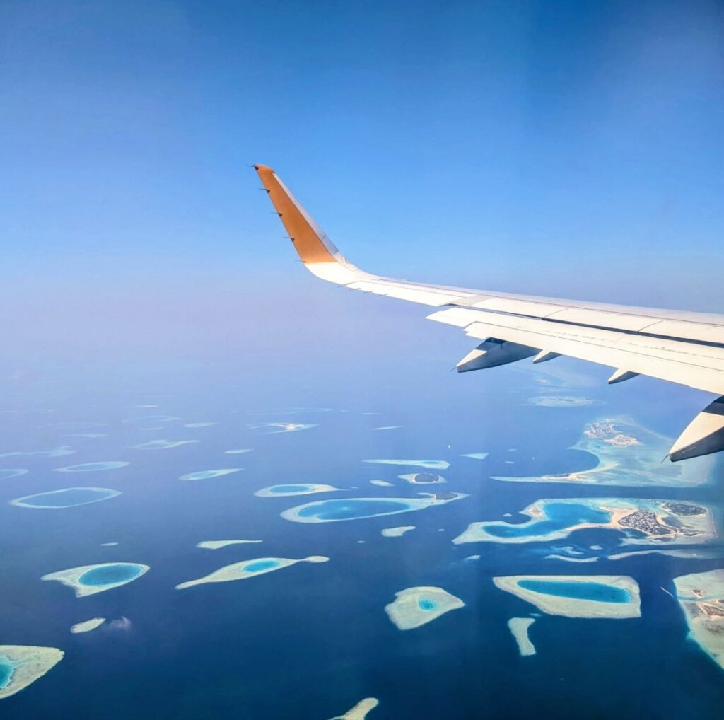 View from an airplane window during a cheap last minute flight to the Maldives