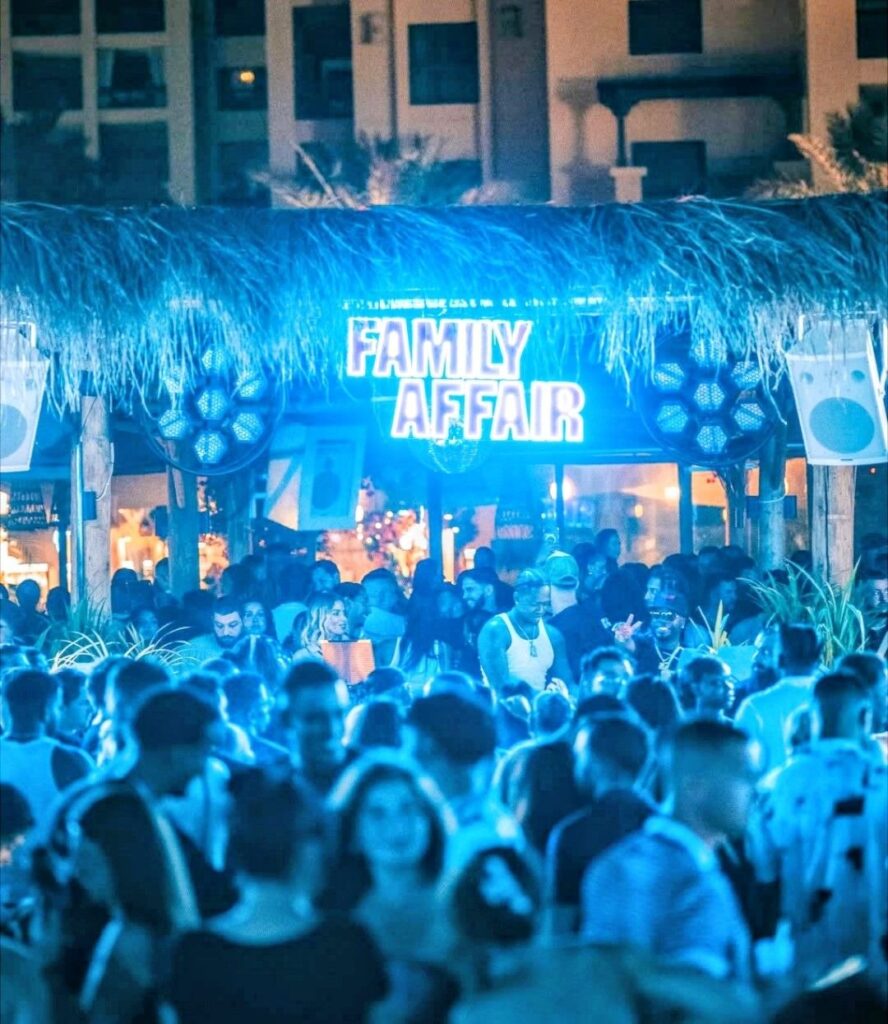 Crowded nightlife atmosphere at Surf Club Dubai on West Beach