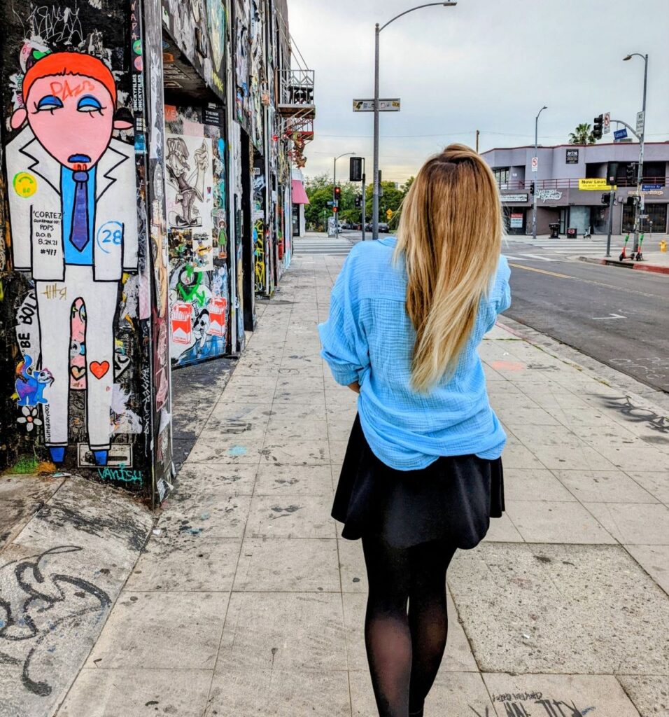 Woman walking through the streets of Los Angeles during her digital nomad journey