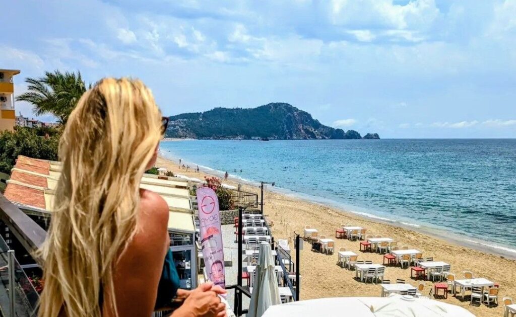 Woman enjoying the sea view in Alanya while living as a digital nomad in Turkey
