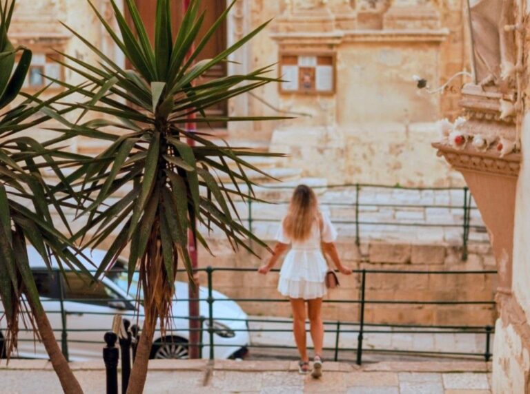 Woman enjoying the streets of Malta during summer travel