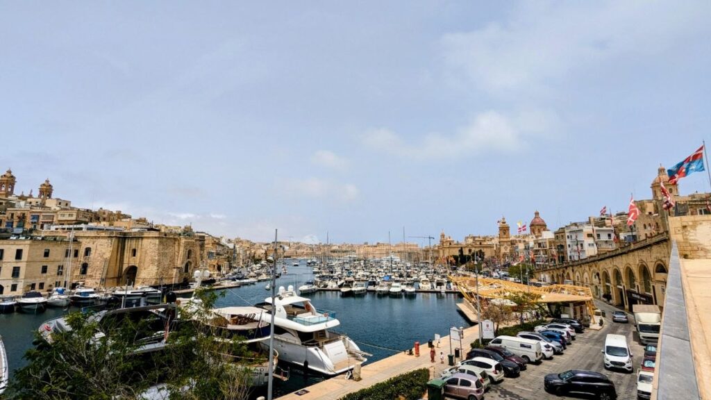 View of Malta marina with boats, historic buildings, and Mediterranean waterfront