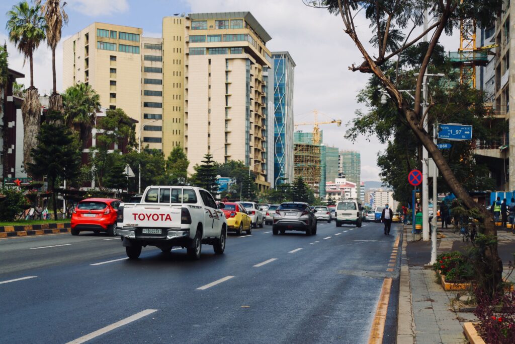 Modern street in central Addis Ababa with traffic, office buildings, and urban development in Ethiopia