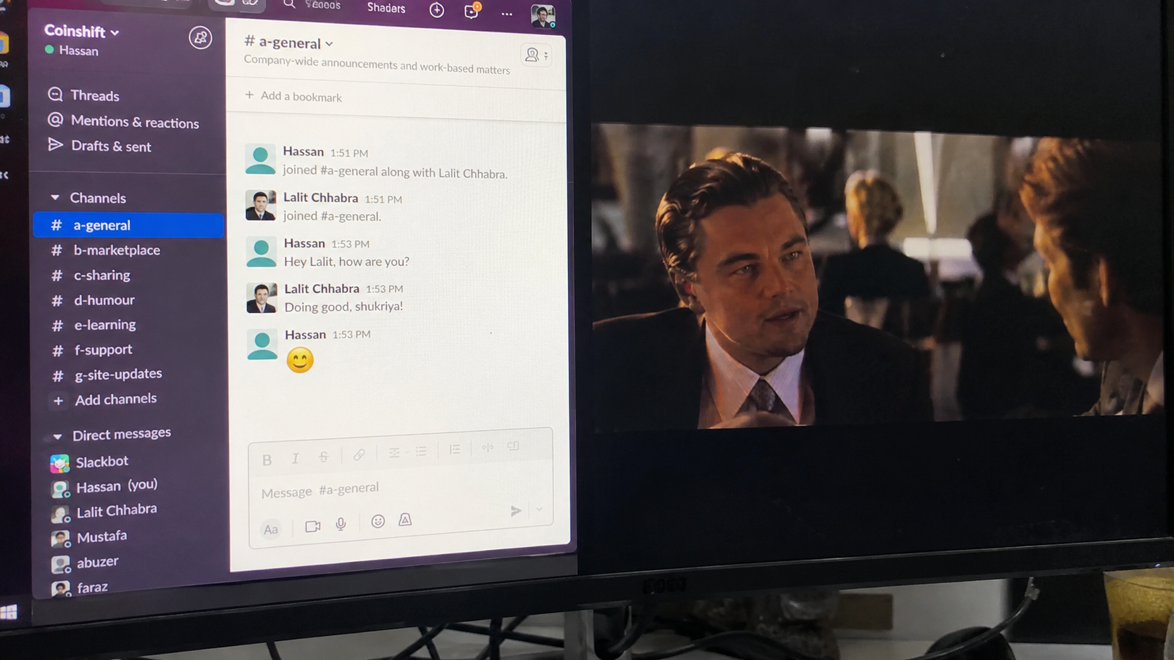 Remote worker watching a movie while Slack remains open on a monitor, illustrating how to keep Slack active during long periods away from the keyboard.