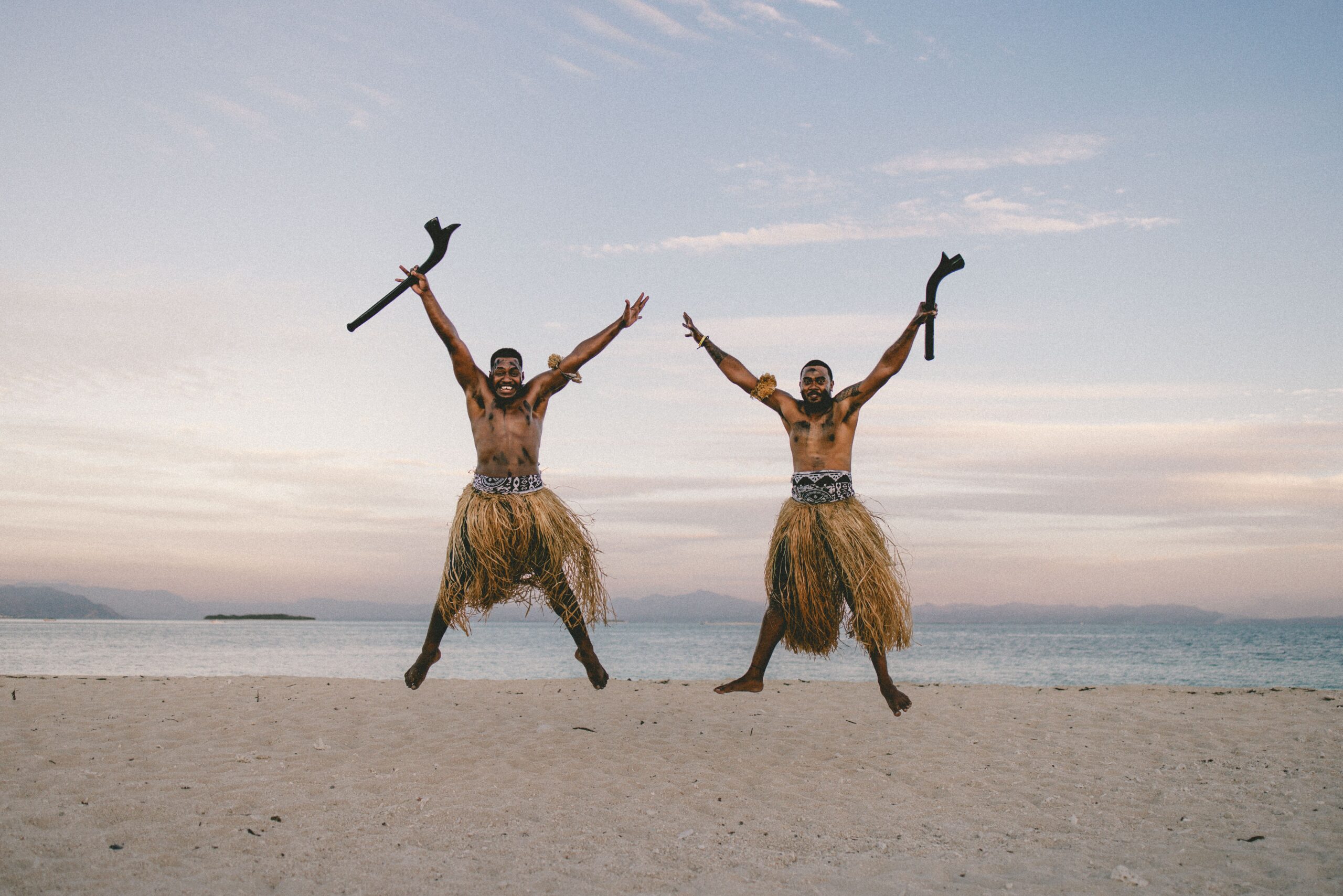 Traditional cultural performance on a beach in Vanuatu, highlighting local culture and everyday life for digital nomads and expats.