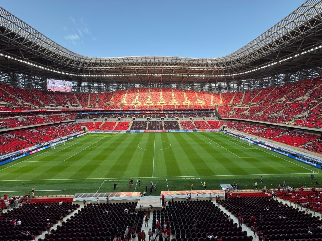 Football stadium during an international soccer match with a full crowd