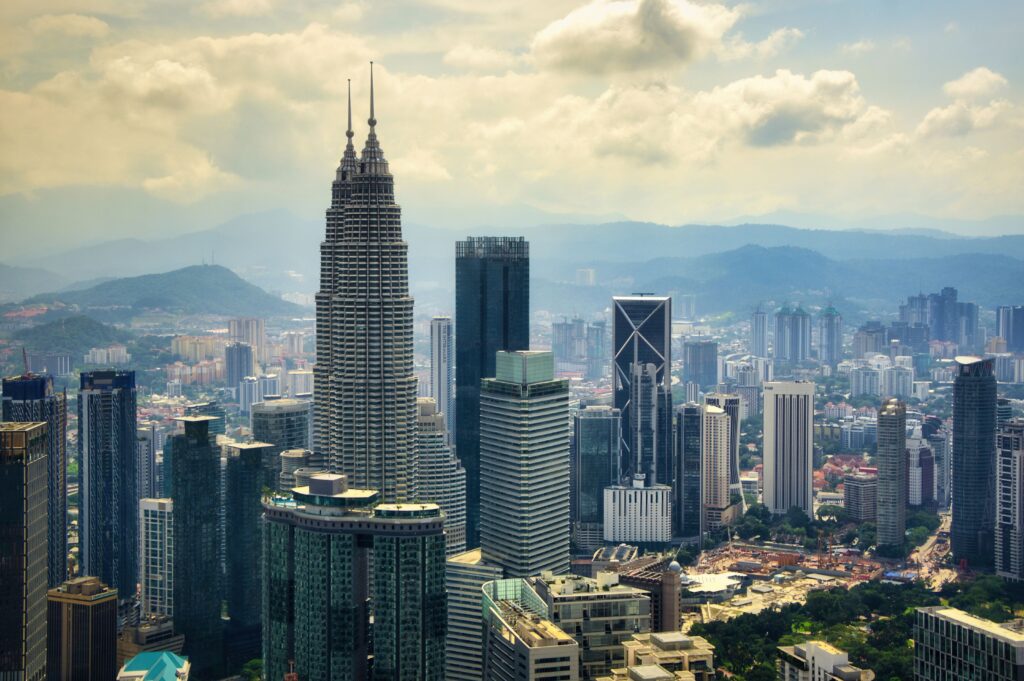 Kuala Lumpur skyline with the Petronas Twin Towers, a popular and affordable destination for digital nomads and remote workers.