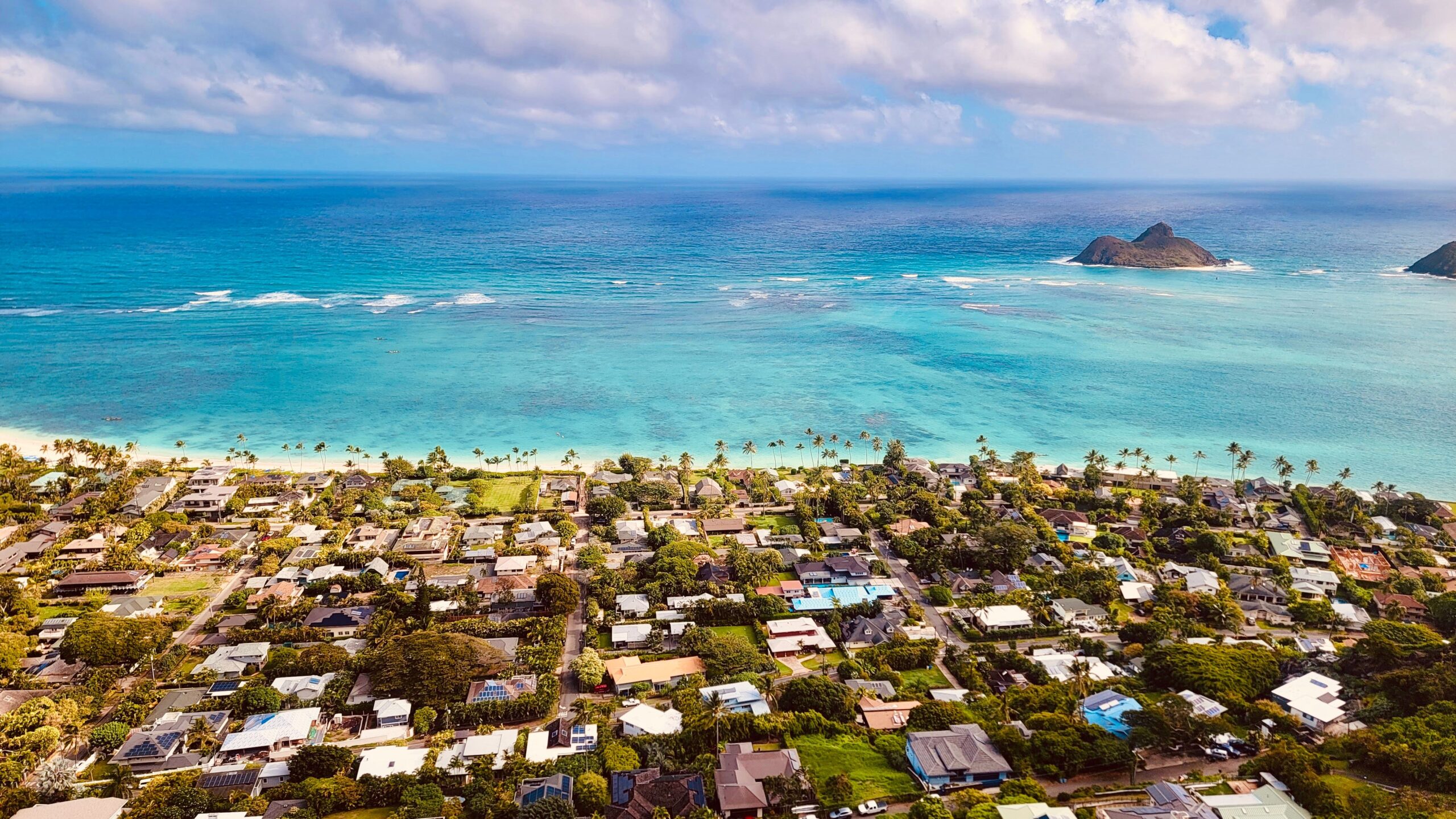 Aerial view of Lanikai Beach, Oahu, Hawaii, with turquoise water and the Mokulua Islands