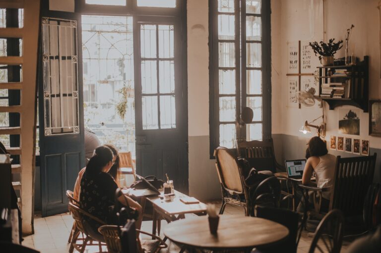 People working on laptops inside a quiet café in Ho Chi Minh City, Vietnam