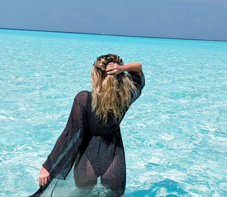 Traveling to the Maldives on a budget while enjoying the crystal-clear waters near Maafushi.