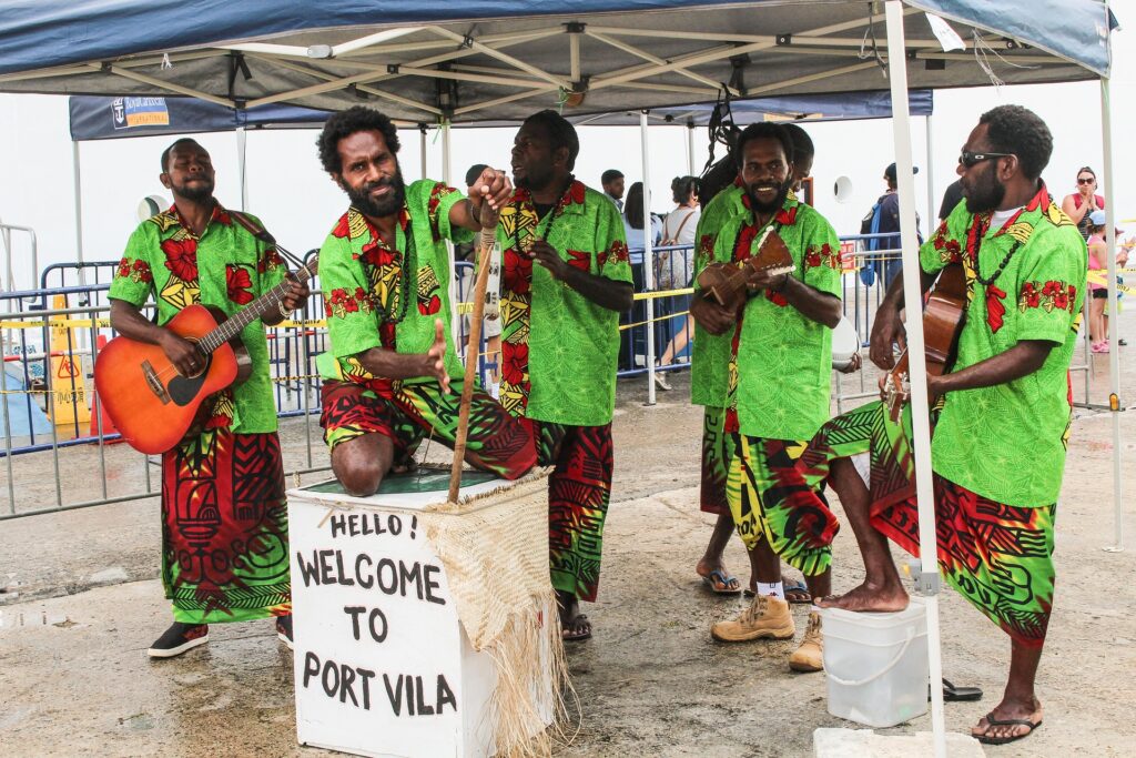 Traditional welcome musicians performing at Port Vila, Vanuatu, greeting visitors with local music and cultural attire