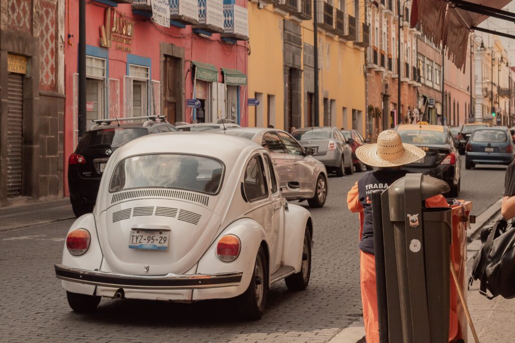 Street scene with a classic Volkswagen Beetle in Mexico City
