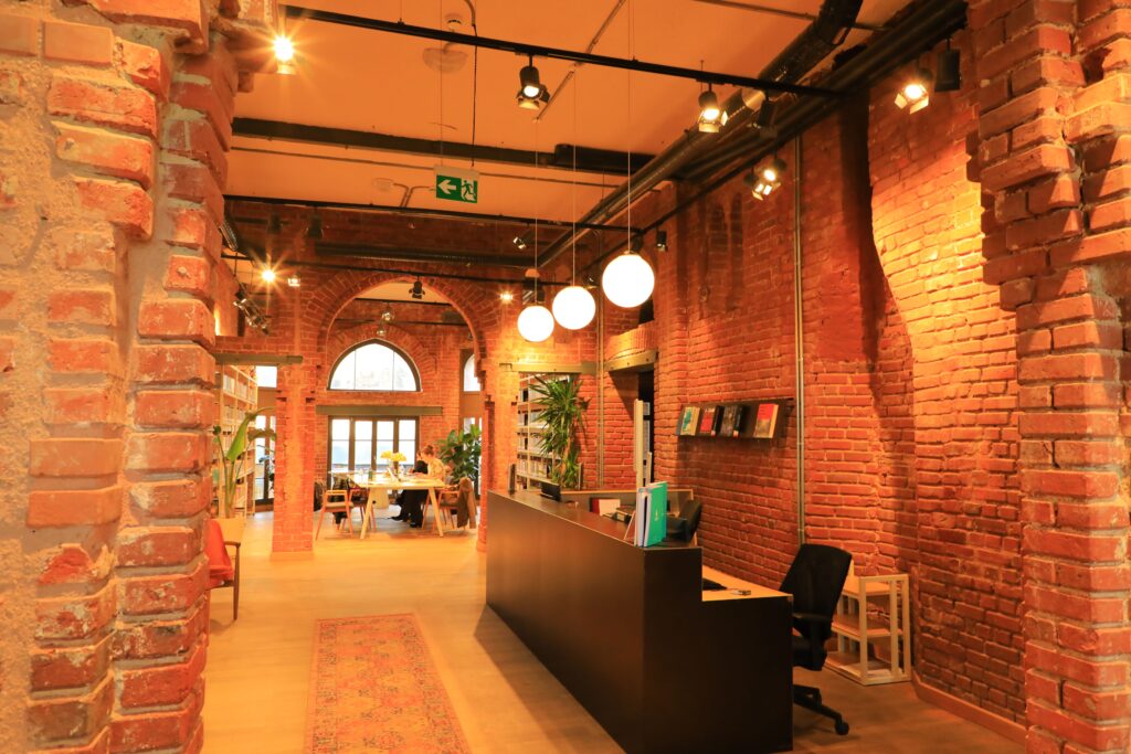 Free coworking space in Istanbul with brick walls, desks and quiet work areas