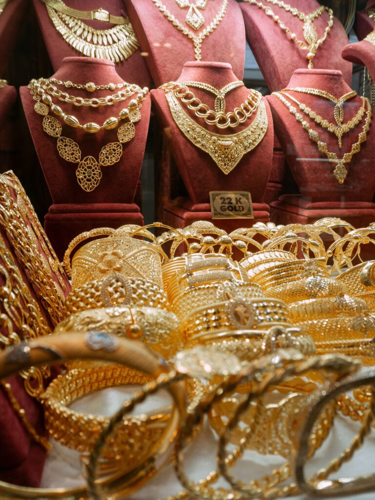 22K yellow gold jewellery displayed in a Dubai gold shop