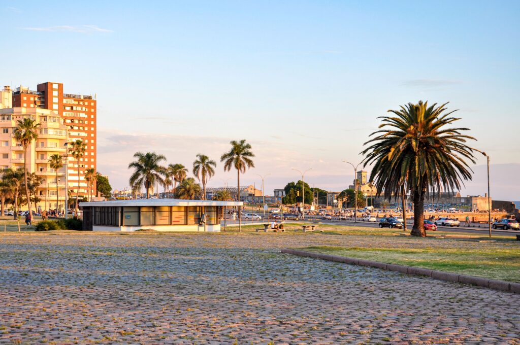 Waterfront area in Montevideo, Uruguay, with palm trees, apartment buildings and an open public space