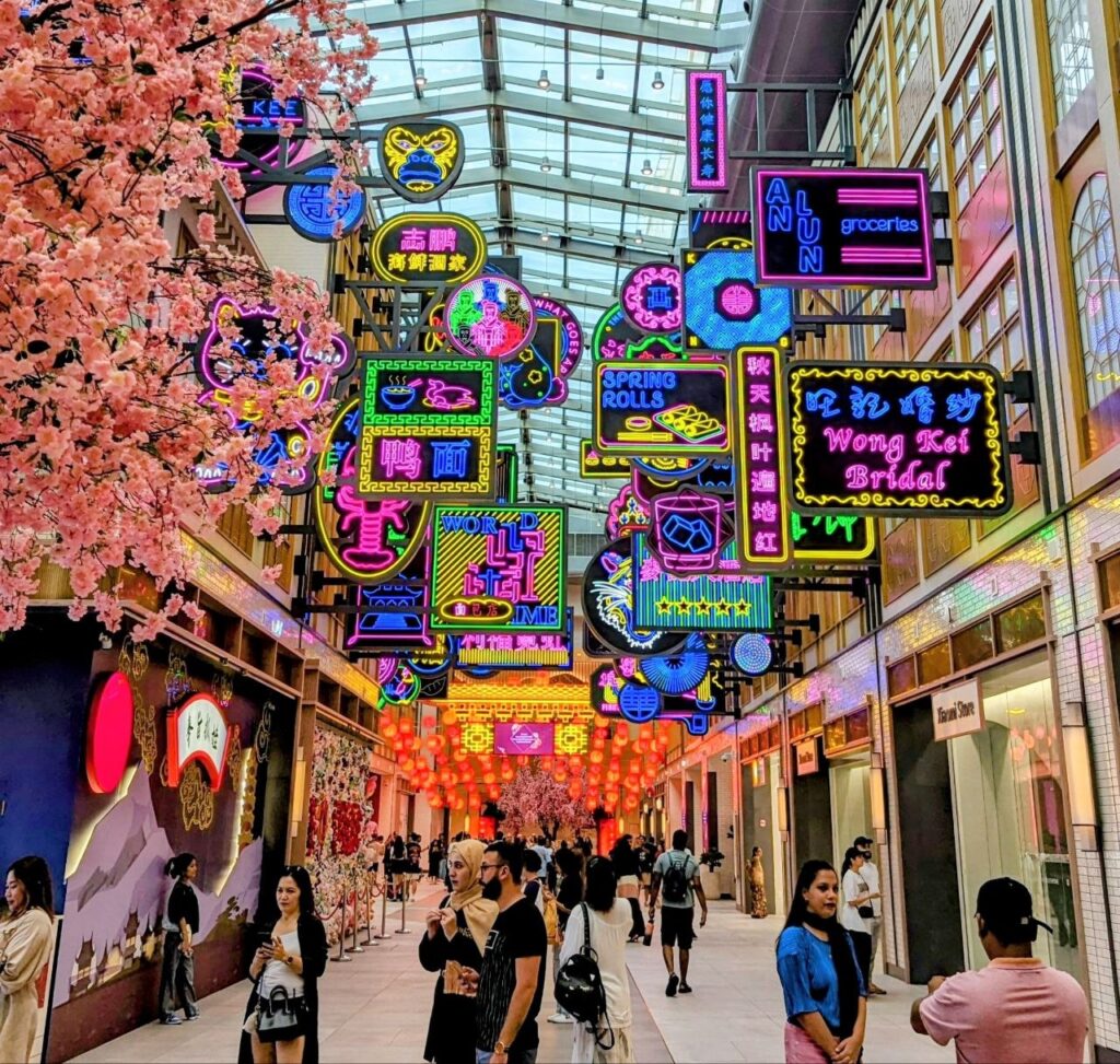 Chinese District inside Dubai Mall with colorful neon signs, lanterns and traditional Asian-inspired street design in Dubai, UAE