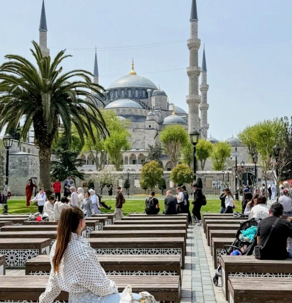 Istanbul in September with the Blue Mosque and people sitting outdoors