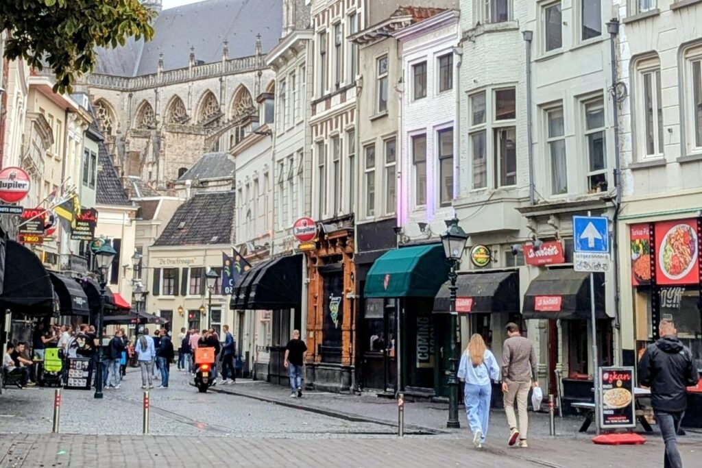 Historic city centre in the Netherlands with cafés and traditional Dutch architecture