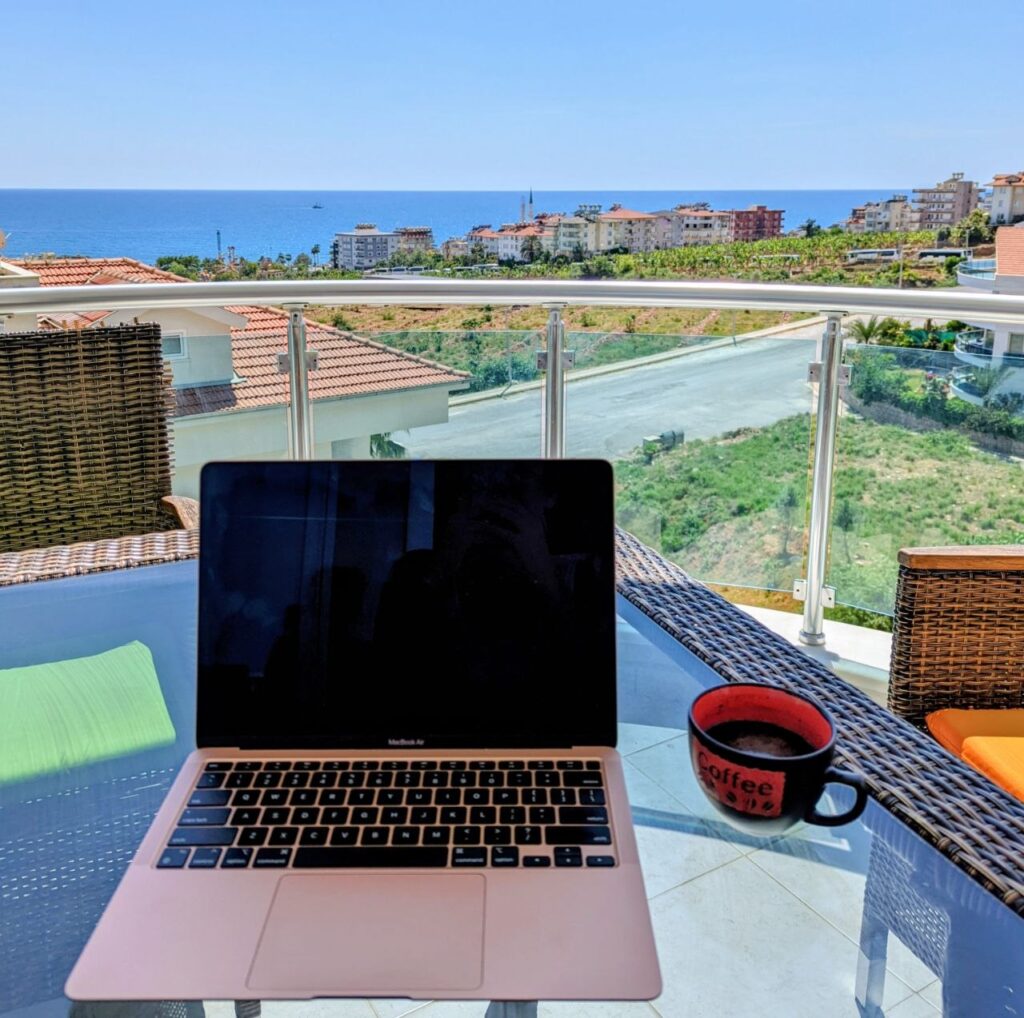 Working remotely from a balcony in Mahmutlar, Alanya, overlooking the Mediterranean Sea